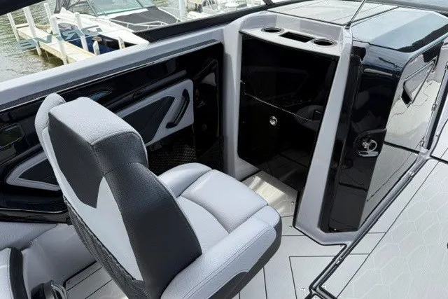 Slide: The Image of 2026 Yamaha Boats 255XD interior with sleek seating and modern design features. - 33