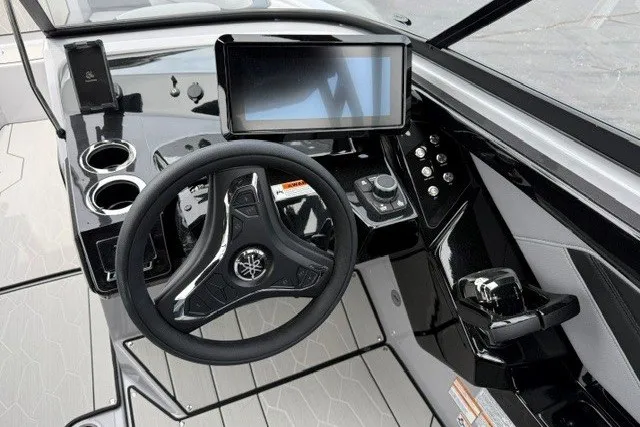 Slide: The Image of 2026 Yamaha Boats 255XD dashboard with steering wheel, touchscreen, and controls. - 30