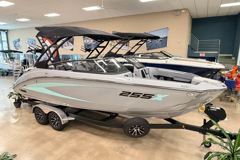 The Image of 2026 Yamaha Boats 255XD displayed indoors on a trailer, featuring sleek design and modern features. - 0