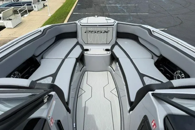 Slide: The Image of 2026 Yamaha Boats 255XD interior with sleek gray seating and modern design. - 35