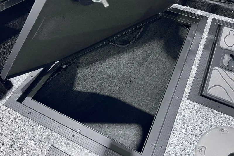 Slide: The Image of Open storage compartment on 2026 Smoker Craft Excursion 166 SC boat. - 17