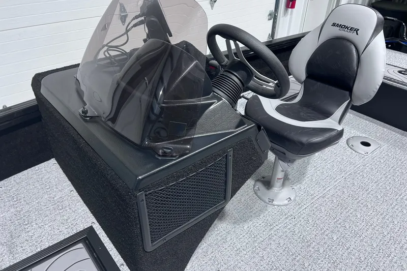 Slide: The Image of 2026 Smoker Craft Excursion 166 SC boat interior with steering console and seat. - 10