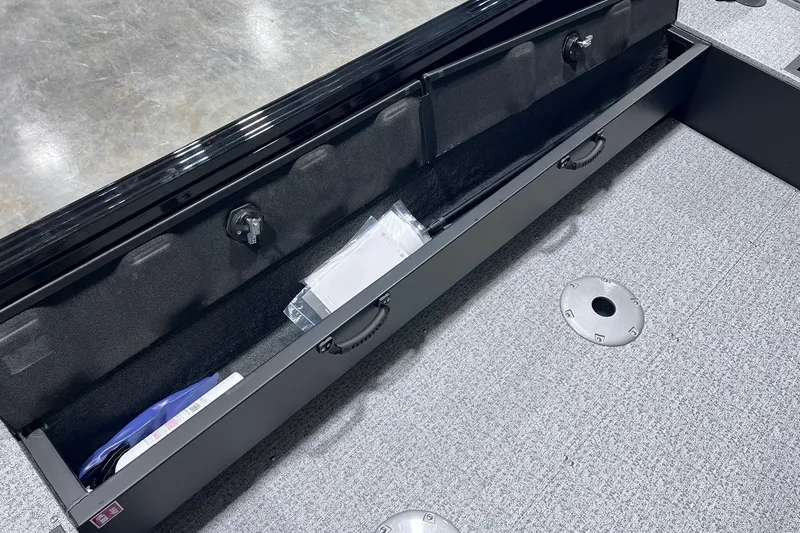 Slide: The Image of Storage compartment of 2026 Smoker Craft Excursion 166 SC boat, featuring organized interior space. - 15