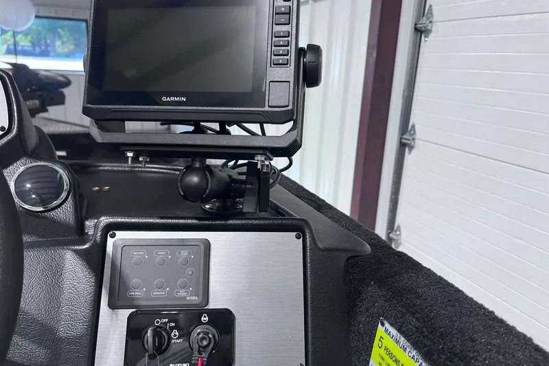 Slide: The Image of 2026 Smoker Craft Excursion 166 SC dashboard with Garmin navigation system. - 12