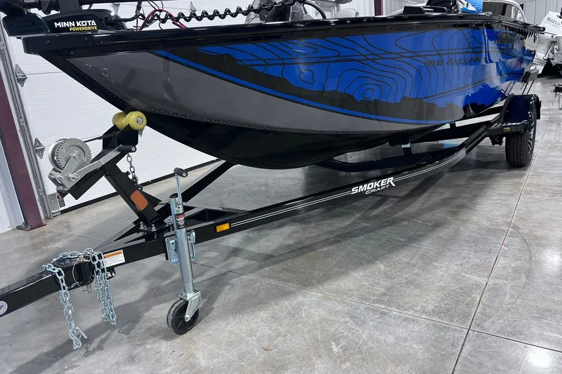 Slide: The Image of 2026 Smoker Craft Excursion 166 SC boat on trailer in showroom. - 4
