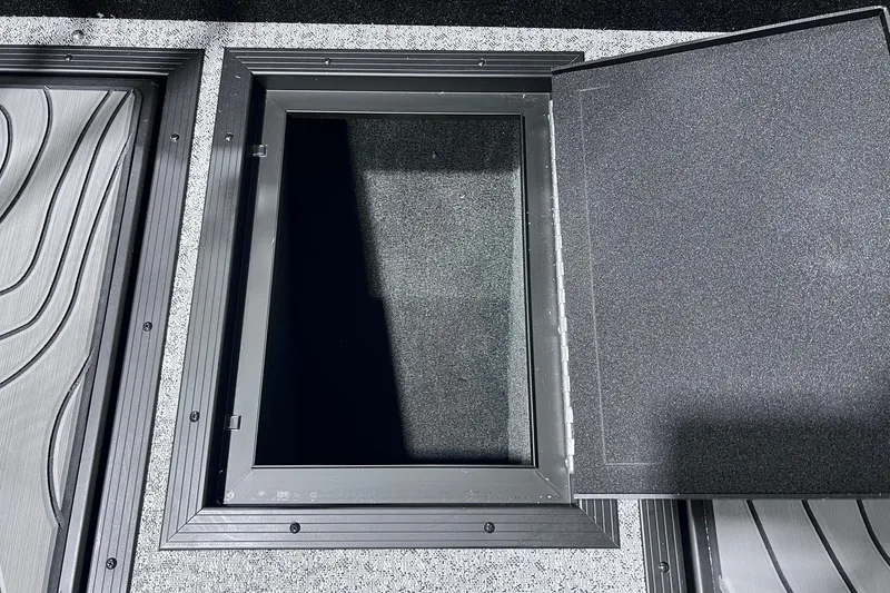 Slide: The Image of Open storage compartment on 2026 Smoker Craft Excursion 166 SC boat. - 19
