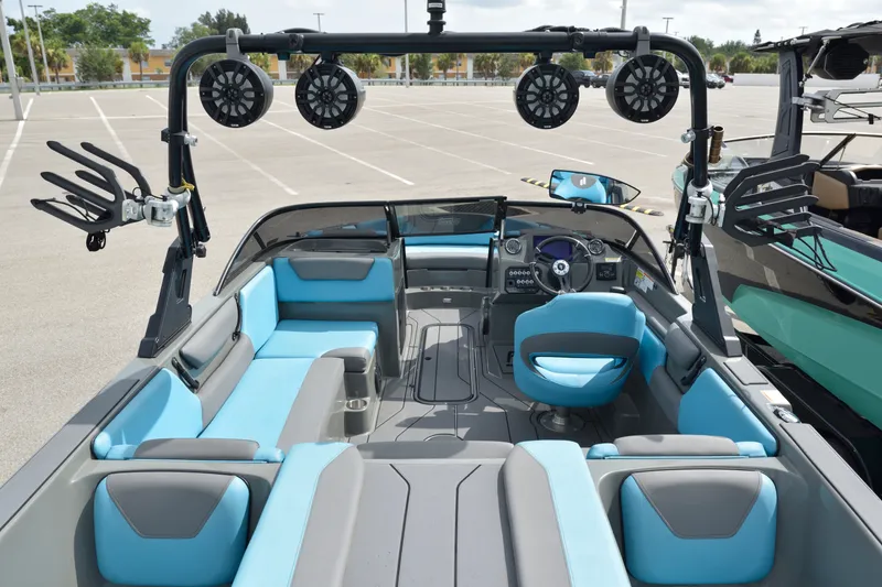 Slide: The Image of 2019 Heyday WT-2 boat interior with blue and gray seating, speakers, and steering console. - 17