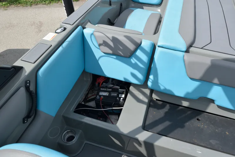 Slide: The Image of 2019 Heyday WT-2 boat interior with blue and gray seating, showing battery compartment. - 21