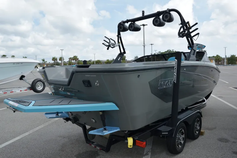 Slide: The Image of 2019 Heyday WT-2 boat on trailer, featuring sleek design and wakeboard tower. - 13