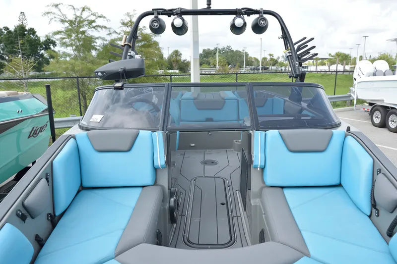Slide: The Image of 2019 Heyday WT-2 boat interior with blue and gray seating, outdoor display setting. - 24