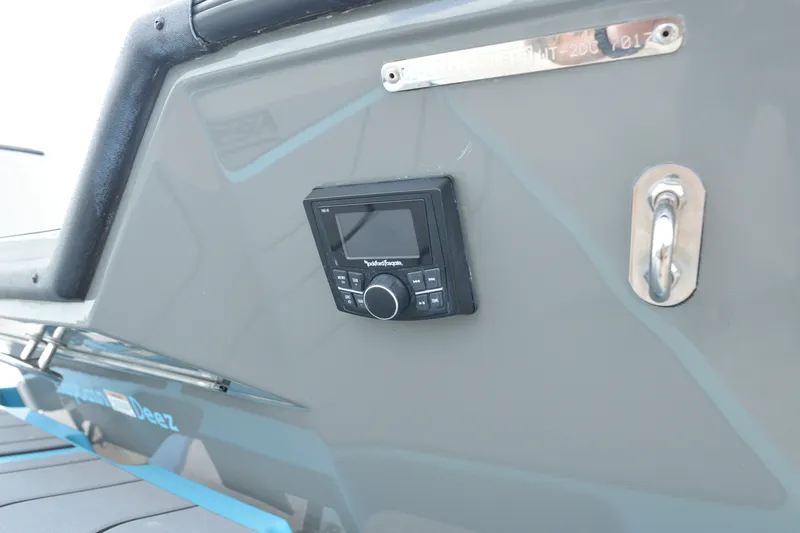 Slide: The Image of Close-up of a gray boat hull with a built-in control panel and a metal handle. - 15