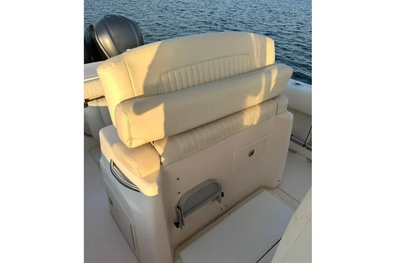 Slide: The Image of 2013 Grady-White Canyon 271 boat seating with ocean backdrop. - 8