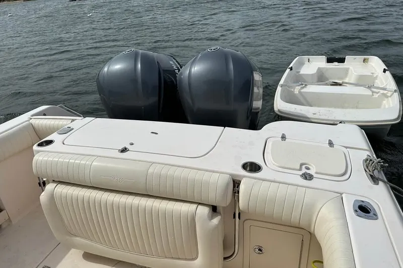 Slide: The Image of 2013 Grady-White Canyon 271 boat with dual engines on water. - 6