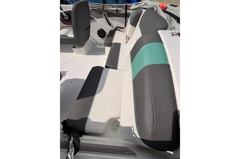 Slide: The Image of 2026 Tahoe T21 boat interior with gray and teal seating. - 10