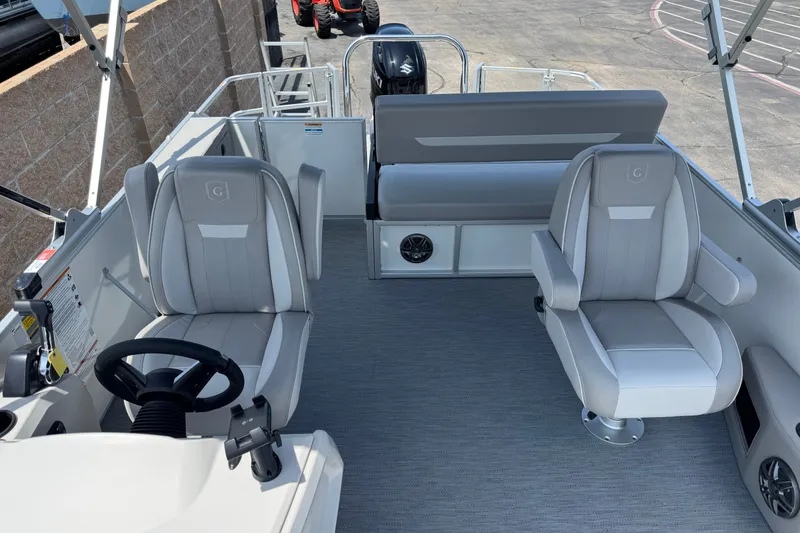 Slide: The Image of 2027 Godfrey Xperience 2286 Flip Lounge interior with modern seating and steering wheel. - 8