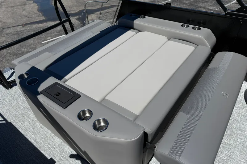 Slide: The Image of Luxurious seating on 2026 Premier 230 Sunsation RL pontoon boat with cup holders and storage. - 31