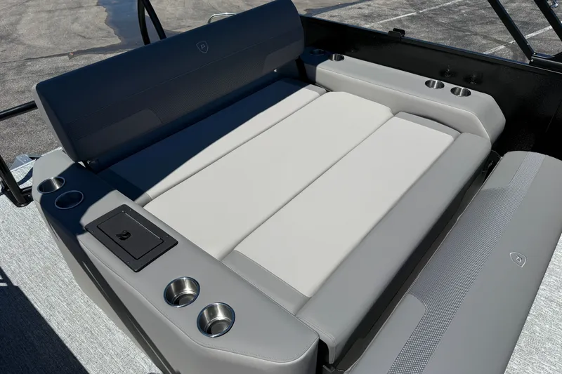 Slide: The Image of Premier 230 Sunsation RL 2026 boat seating with cup holders and storage compartment. - 33
