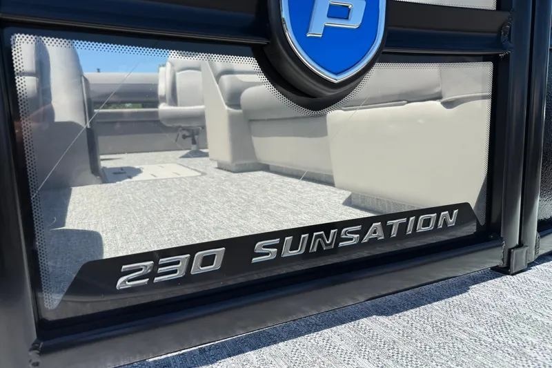 Slide: The Image of 2026 Premier 230 Sunsation RL boat interior with logo and seating reflection. - 5