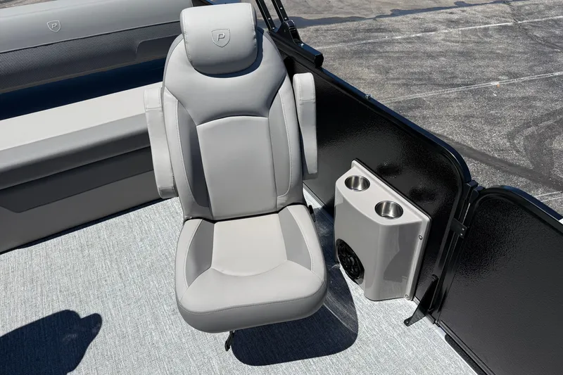 Slide: The Image of Luxurious seating on 2026 Premier 230 Sunsation RL boat with cup holders and speaker. - 17