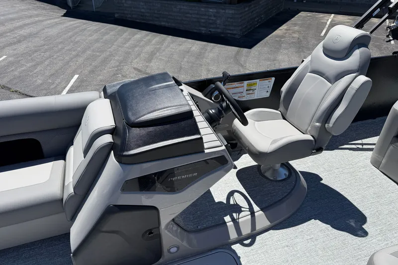 Slide: The Image of 2026 Premier 230 Sunsation RL boat interior with sleek captain's chair and modern dashboard. - 22
