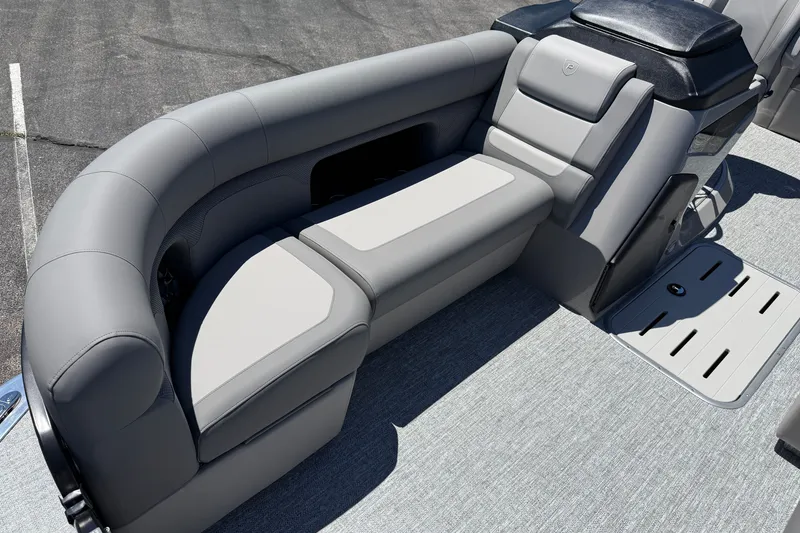 Slide: The Image of Luxurious seating on 2026 Premier 230 Sunsation RL pontoon boat, featuring sleek gray upholstery. - 16