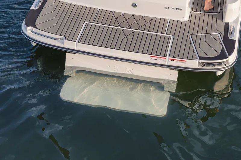 Slide: The Image of The image shows the stern of a 2027 Sea Ray SLX 280 boat in the water. - 19