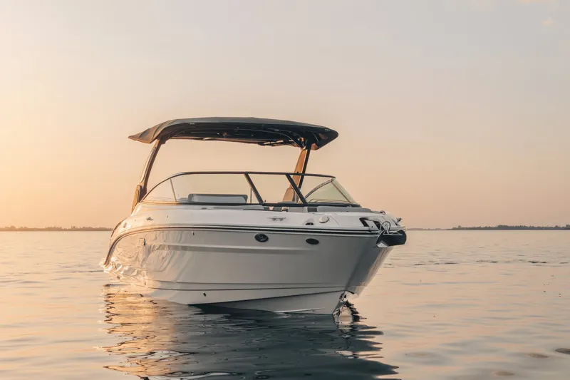 Slide: The Image of A 2027 Sea Ray SLX 280 on calm water at sunset. - 41