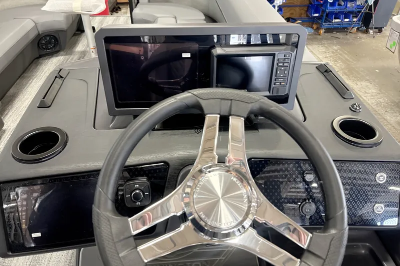 Slide: The Image of Steering console of 2027 Bennington 24 M Open Fastback Quad Bench with modern controls. - 12