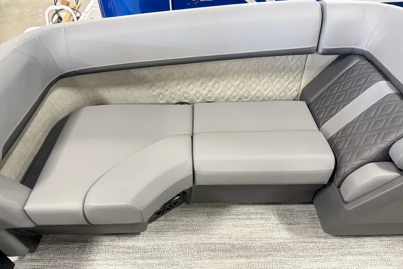 Slide: The Image of 2027 Bennington 24 M Open Fastback Quad Bench with luxurious gray seating and diamond-patterned accents. - 10