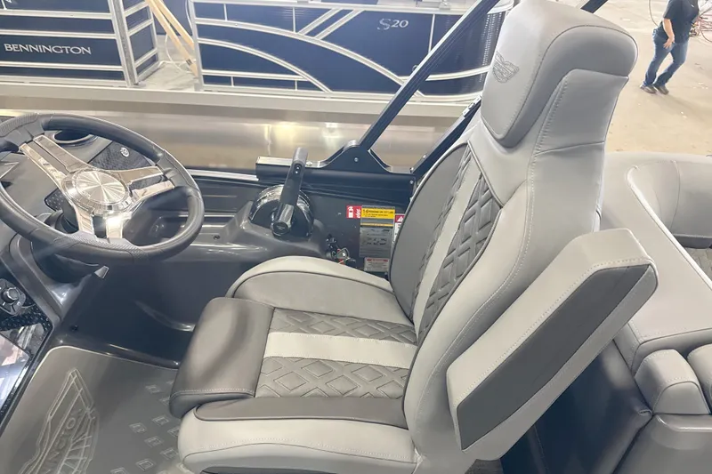 Slide: The Image of Luxurious interior of 2027 Bennington 24 M Open Fastback Quad Bench with sleek steering and seating. - 14