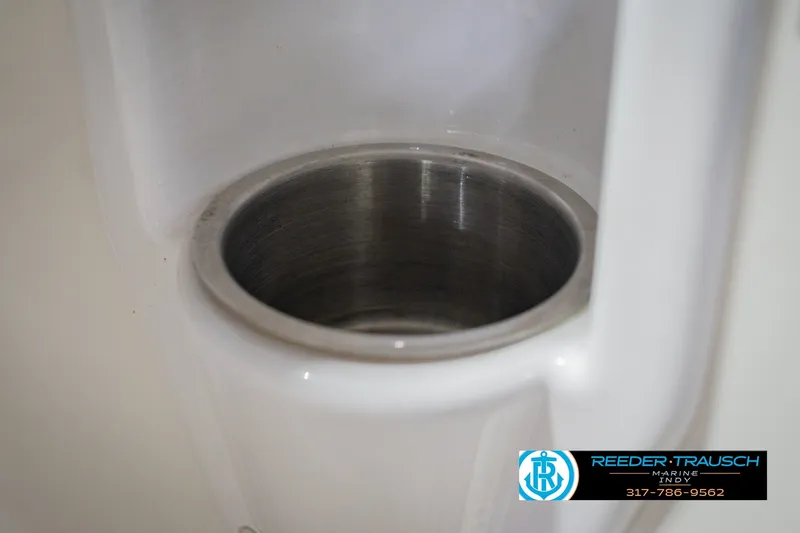 Slide: The Image of Cup holder in a 2007 Larson LXi 228 Wakeboard Edition boat interior. - 50