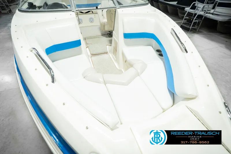 Slide: The Image of 2007 Larson LXi 228 Wakeboard Edition boat interior with white and blue seating. - 14