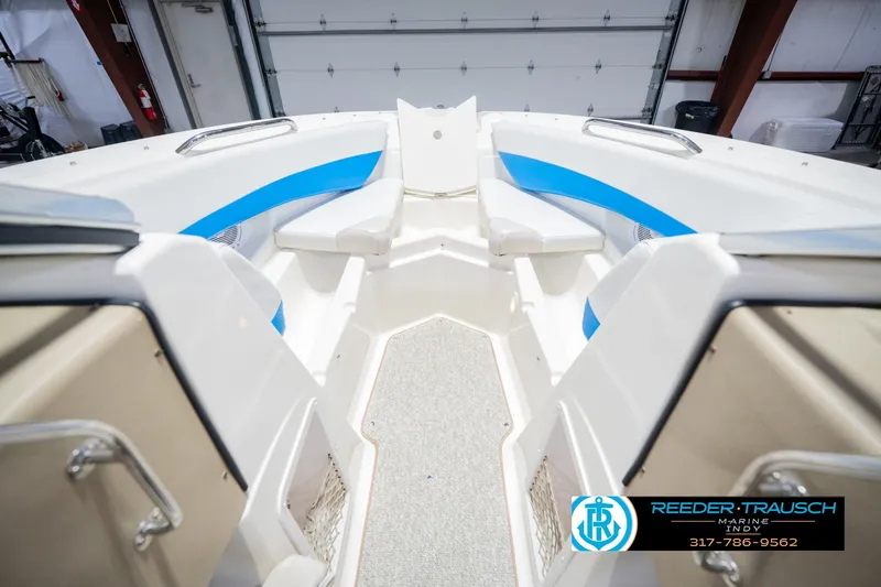 Slide: The Image of 2007 Larson LXi 228 Wakeboard Edition boat interior with blue accents and seating. - 30