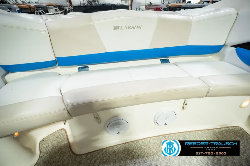 Slide: The Image of 2007 Larson LXi 228 Wakeboard Edition boat interior seating with blue accents. - 47
