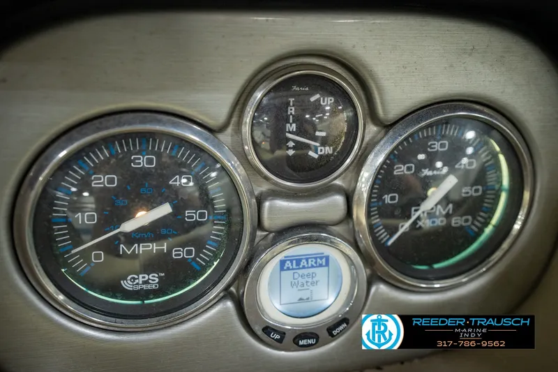 Slide: The Image of 2007 Larson LXi 228 Wakeboard Edition dashboard with speedometer, RPM gauge, and trim indicator. - 38