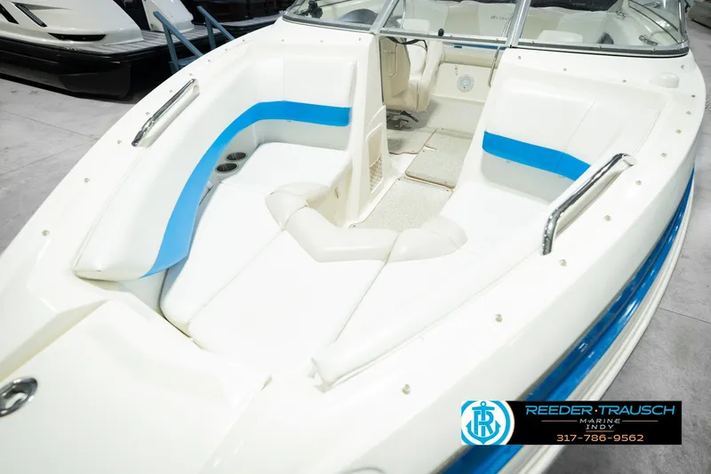Slide: The Image of 2007 Larson LXi 228 Wakeboard Edition boat interior with blue accents. - 13