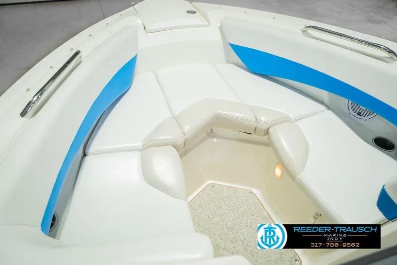 Slide: The Image of 2007 Larson LXi 228 Wakeboard Edition boat interior with white and blue seating. - 46