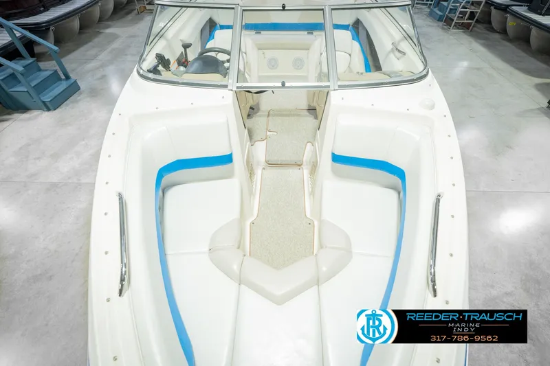 Slide: The Image of 2007 Larson LXi 228 Wakeboard Edition boat interior with white and blue seating. - 22