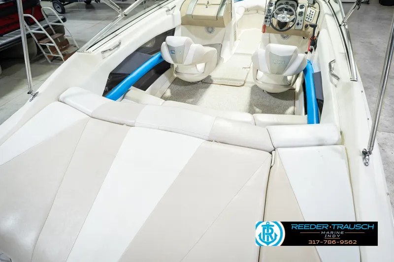 Slide: The Image of 2007 Larson LXi 228 Wakeboard Edition interior with beige seating and modern dashboard. - 16