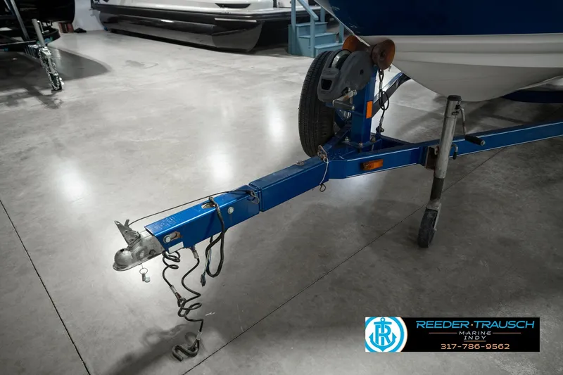 Slide: The Image of Trailer hitch of a 2007 Larson LXi 228 Wakeboard Edition boat in a showroom. - 59