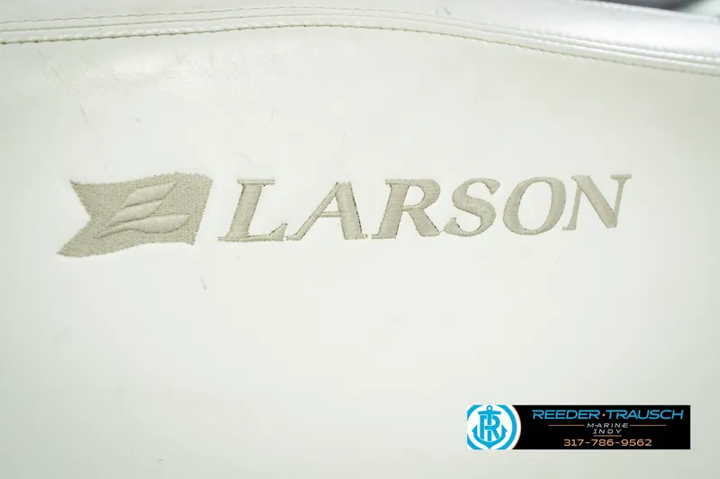 Slide: The Image of Larson LXi 228 Wakeboard Edition 2007 logo on white upholstery, Reeder Trausch Marine contact info. - 48