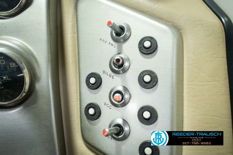 Slide: The Image of Control panel of a 2007 Larson LXi 228 Wakeboard Edition boat with switches and dials. - 41