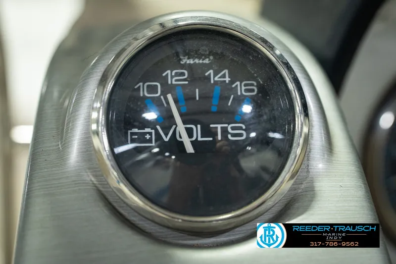 Slide: The Image of Close-up of a voltmeter gauge on a 2007 Larson LXi 228 Wakeboard Edition boat. - 37