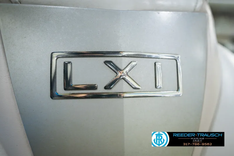 Slide: The Image of 2007 Larson LXi 228 Wakeboard Edition emblem on a sleek, metallic surface. - 45