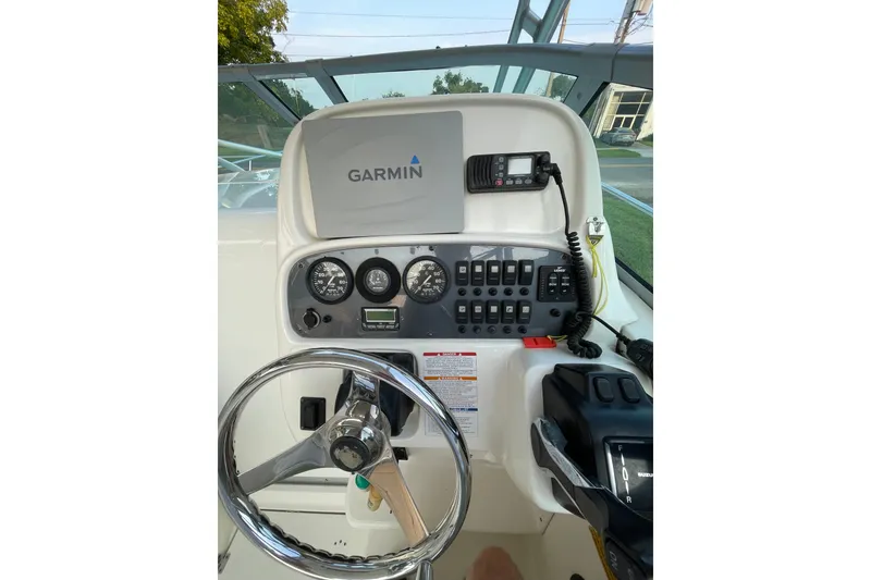 Slide: The Image of 2007 Robalo R265 Walkaround helm with Garmin navigation and control panel. - 20