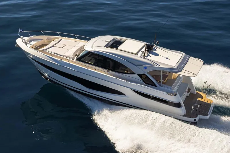 Slide: The Image of Manufacturer Provided Image: 2026 Riviera 4300 Sport Express yacht cruising on open water. - 2