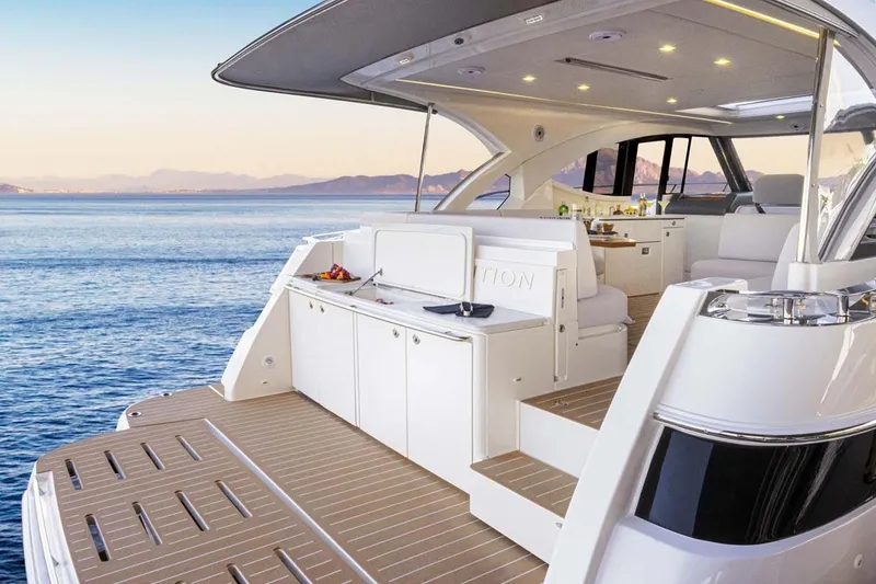Slide: The Image of Manufacturer Provided Image: Luxurious 2026 Riviera 4300 Sport Express yacht with elegant deck and scenic ocean view. - 8