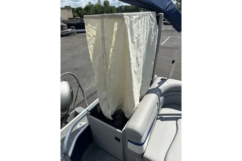 Slide: The Image of 2022 Bennington 2286 boat with privacy curtain and seating area. - 14