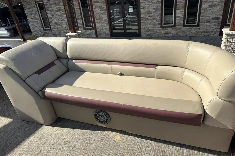 Slide: The Image of 2022 Bennington 2286 boat seating with beige upholstery and built-in speaker. - 11