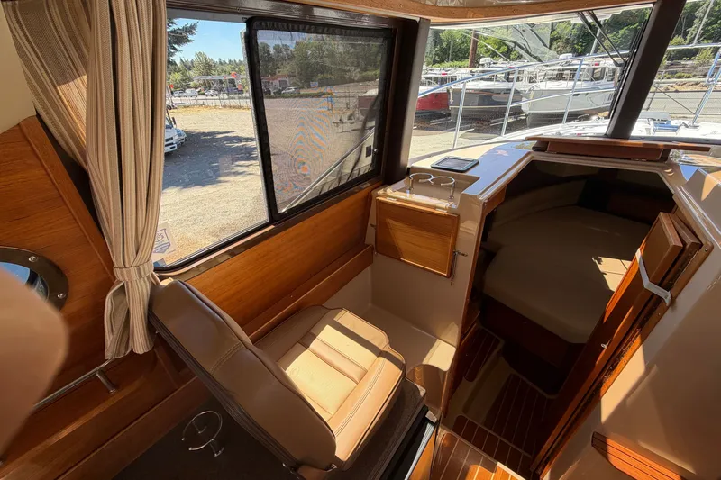 Slide: The Image of Interior of 2020 Ranger Tugs R-29 S boat with seating and cabin view. - 14